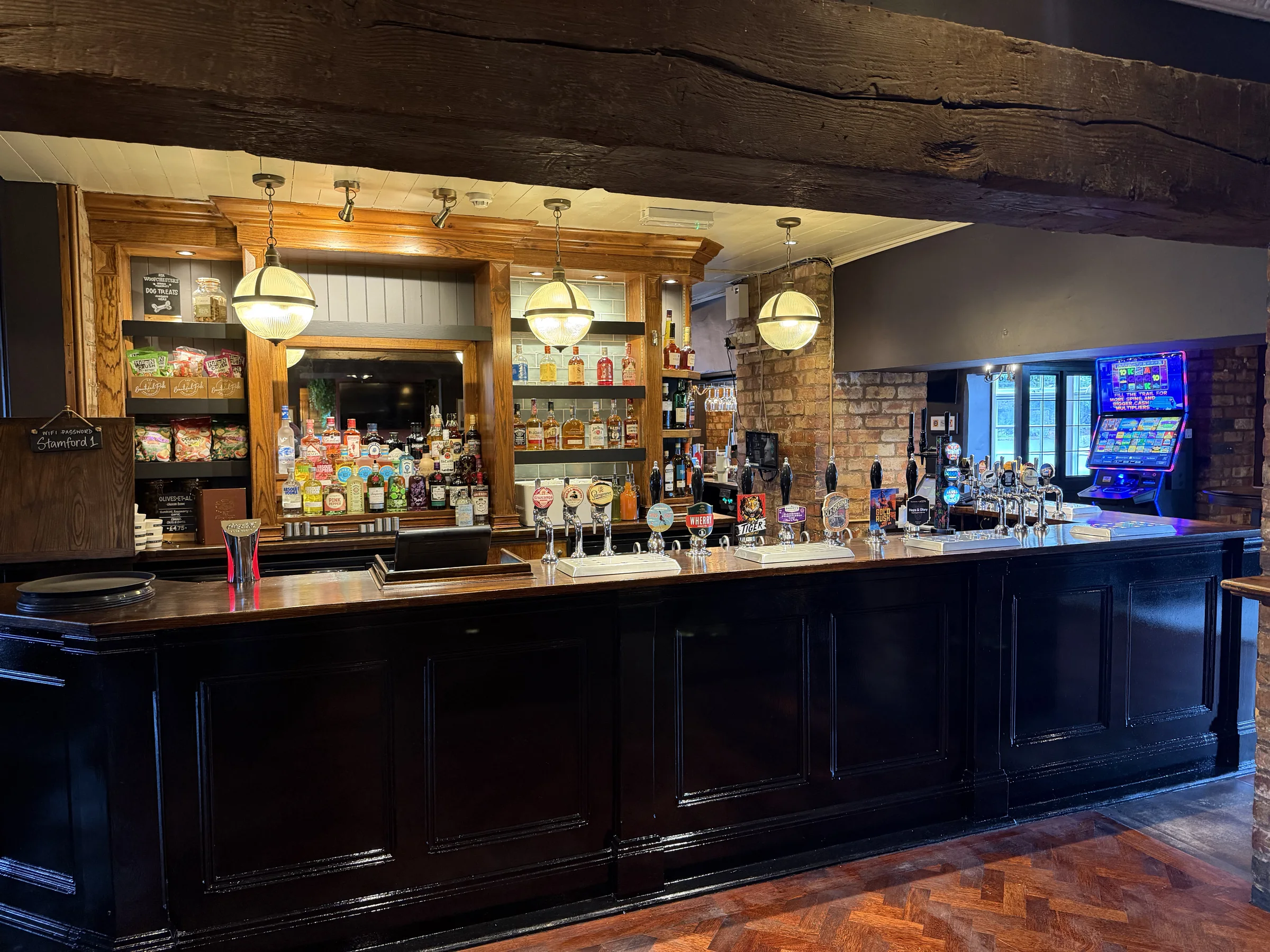 The Stamford Arms bar with beer pumps and hanging lights